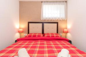 Postel nebo postele na pokoji v ubytování Apartman Lidija