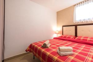 Postel nebo postele na pokoji v ubytování Apartman Lidija