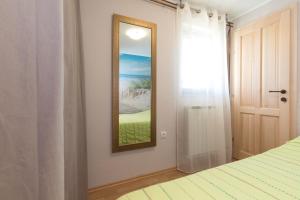 Postel nebo postele na pokoji v ubytování Apartman Lidija
