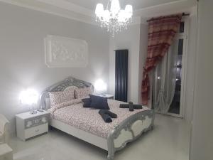 A bed or beds in a room at Black & White