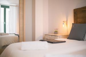 Postel nebo postele na pokoji v ubytování Apartaments Catedral – Baltack Homes