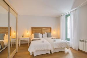 Postel nebo postele na pokoji v ubytování Apartaments Catedral – Baltack Homes