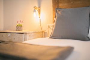Postel nebo postele na pokoji v ubytování Apartaments Catedral – Baltack Homes