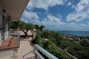 a balcony of a house with a view of the ocean at L'Ulivo Sul Mare in Cetraro