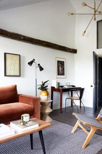 a living room with a couch and a table at Cosy Loft Apartment - minutes from Angel Tube St. in London