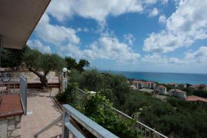 a balcony with a view of the ocean at L'Ulivo Sul Mare in Cetraro +8 photos