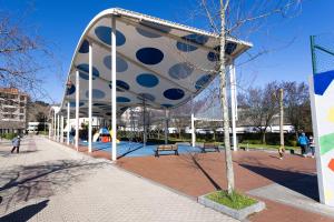 a playground in a park with a large object at Zarautz SALBIDE APARTMENTS in Zarautz