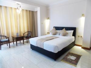 Säng eller sängar i ett rum på Villa Grazia Luxury Hotel