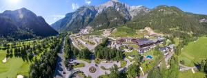 an aerial view of a resort in the mountains at Brandlhof lodge in Saalfelden am Steinernen Meer