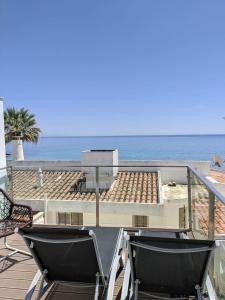 a view of the beach from the balcony of a house at Calheta 25 in Luz