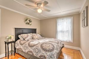 a bedroom with a bed and a ceiling fan at Newport House Less Than 3 Mi to Beaches and Bowens Wharf! in Newport