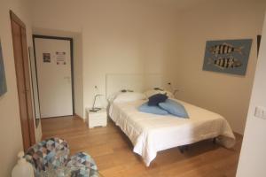 Postel nebo postele na pokoji v ubytování vernazza vacation 3