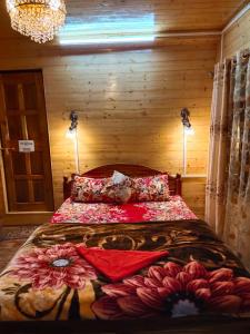 a bedroom with a large bed in a wooden room at Beautiful View Homestay in Darjeeling