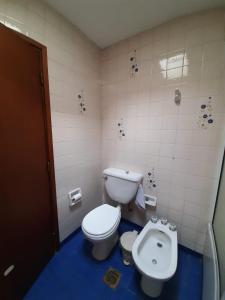 a bathroom with a toilet and a bidet at Dos Balcones in Salta