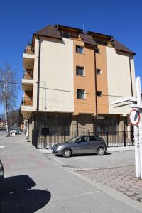 a car parked in front of a building at Къща за гости Шошови in Velingrad