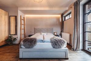 Postel nebo postele na pokoji v ubytování Resort Mlýn Černovice