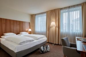 Postel nebo postele na pokoji v ubytování Das Triest Hotel