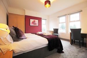 A bed or beds in a room at Large period Chester home right on the canal.