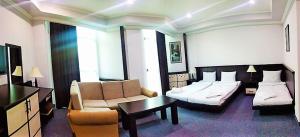 Voodi või voodid majutusasutuse DDD Hotel toas