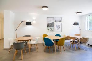 a group of tables and chairs in a room at Citadines Antigone Montpellier in Montpellier +16 photos
