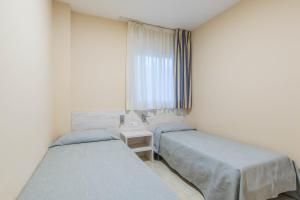 Postel nebo postele na pokoji v ubytování Apartaments Costamar Calafell + 37 fotografií