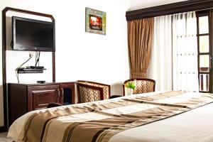 Postel nebo postele na pokoji v ubytování PrideInn Flamingo Beach Resort & Spa Mombasa