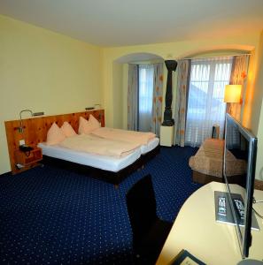 Postel nebo postele na pokoji v ubytování Ambiente Hotel Freieck