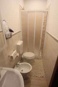 a small bathroom with a toilet and a sink at Vernazza Vacation 2 in Vernazza