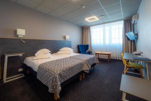 Postel nebo postele na pokoji v ubytování Centrum Hotel Viljandi