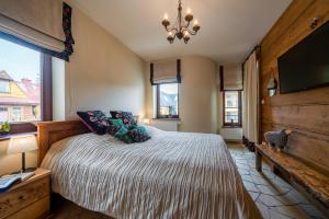 Posteľ alebo postele v izbe v ubytovaní Apartament Zielony Blisko Krupówek