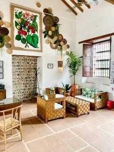 a living room filled with furniture and plants at Casa Bixa Hotel Boutique - Solo Adultos in Santa Fe de Antioquia