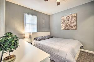 a bedroom with a bed and a potted plant at Lees Summit Home Less Than 4 Mi to Dtwn Main Street in Lees Summit