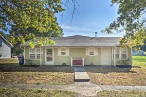 a house with a driveway in front of it at Lees Summit Home Less Than 4 Mi to Dtwn Main Street in Lees Summit