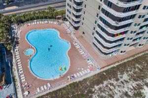 an overhead view of a swimming pool next to a building at Tidewater Beach Resort by Panhandle Getaways in Panama City Beach