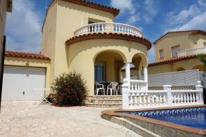a house with a swimming pool in front of it at AME737 in Les tres Cales