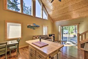 a living room with a table and a couch at Cozy Hikers Getaway, 5 Mi to Mt Rainier Natl Park in Ashford