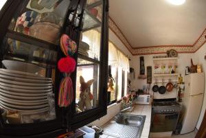 A kitchen or kitchenette at HOTEL CASA LIMON