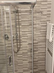 a shower in a bathroom with a glass door at Affittacamere Le Grotte - Le Grotte Rooms & Apartments in Camerano +41 photos