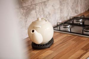 a white pot sitting on top of a stove at Seascape in Whitley Bay