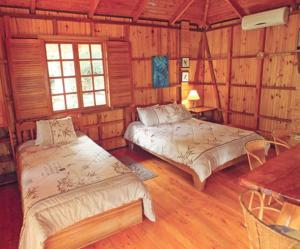 Voodi või voodid majutusasutuse Ciudad Perdida EcoLodge toas