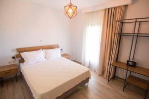 Postel nebo postele na pokoji v ubytování Casa Villa, Xenia Paliouri