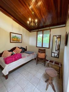A bed or beds in a room at Finca Isla Rainforest Retreat