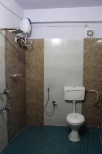a bathroom with a toilet and a shower at PG Homes in Port Blair
