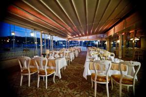 a dining room with white tables and chairs at Fuat Pasa Oteli - Special Category Bosphorus in Istanbul