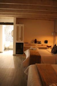 a large room with two beds and a kitchen at Casa Martha hotel boutique in Tequisquiapan