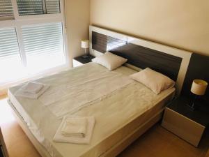 Un pat sau paturi într-o cameră la Punta Cormoran