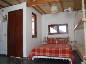 Cama o camas de una habitación en Chalés Ubatubaloft