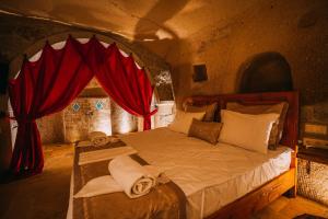 A bed or beds in a room at Prime Cappadocia Suites