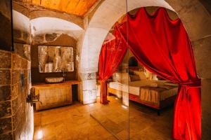 A bed or beds in a room at Prime Cappadocia Suites