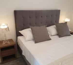 Ένα ή περισσότερα κρεβάτια σε δωμάτιο στο Villa Aquamarine Apartments